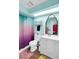 Bright bathroom featuring a modern vanity, stylish mirror, and a vibrant shower curtain at 544 N Fogg St, Las Vegas, NV 89110