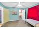 Bright bedroom featuring neutral carpet, a walk-in closet, and soothing blue walls at 544 N Fogg St, Las Vegas, NV 89110