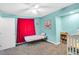 Charming bedroom with blue walls, neutral carpet, and bright accents for a warm and inviting feel at 544 N Fogg St, Las Vegas, NV 89110