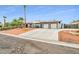 Single-story home boasts three-car garage, desert landscaping, and gated side yard at 544 N Fogg St, Las Vegas, NV 89110