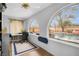 Home office featuring pool views from large arched windows at 544 N Fogg St, Las Vegas, NV 89110
