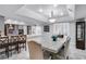 Bright kitchen open to the dining area featuring pendant lighting and tile floors at 544 N Fogg St, Las Vegas, NV 89110