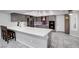 Modern kitchen with stainless steel appliances, gray cabinets, and a center island at 544 N Fogg St, Las Vegas, NV 89110