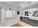 Open kitchen featuring marble tile floor, white countertops, gray cabinets and a ceiling fan at 544 N Fogg St, Las Vegas, NV 89110