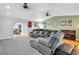 Spacious living room featuring hardwood flooring and plush gray carpeted seating at 544 N Fogg St, Las Vegas, NV 89110