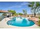 Sparkling pool featuring a jacuzzi with rock details at 544 N Fogg St, Las Vegas, NV 89110