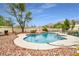 Sparkling pool featuring rock details and mountain views at 544 N Fogg St, Las Vegas, NV 89110