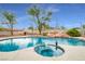 Sparkling pool featuring a jacuzzi with rock details at 544 N Fogg St, Las Vegas, NV 89110