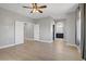 Spacious bedroom with hardwood floors leading to an arched entrance to the bathroom at 626 Taliput Palm Pl, Henderson, NV 89011
