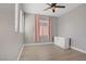 Cozy bedroom featuring hardwood floors, natural light, and white dresser at 626 Taliput Palm Pl, Henderson, NV 89011