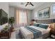 Cozy bedroom with soft lighting, modern decor, and a calming color palette at 626 Taliput Palm Pl, Henderson, NV 89011