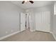 Bedroom featuring hardwood floors, a closet with sliding doors, and an open door at 626 Taliput Palm Pl, Henderson, NV 89011