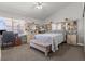 Comfortable bedroom featuring a plush bed, coordinating furniture, and a bright window at 6292 Belgium Dr, Las Vegas, NV 89122