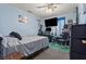 Bedroom with a ceiling fan and decorated with a desk, computer, and various other items at 6292 Belgium Dr, Las Vegas, NV 89122
