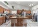 Gourmet kitchen with granite countertops, stainless appliances, and central island at 6292 Belgium Dr, Las Vegas, NV 89122