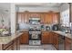 Updated kitchen featuring stainless steel appliances and granite countertops at 6292 Belgium Dr, Las Vegas, NV 89122