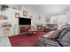 Comfortable living room with TV, fireplace, and elegant decor at 6292 Belgium Dr, Las Vegas, NV 89122