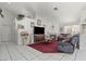 Cozy living room featuring a fireplace, tile flooring, and comfortable seating at 6292 Belgium Dr, Las Vegas, NV 89122