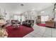 Bright living room with vaulted ceilings, chandelier, and comfortable seating at 6292 Belgium Dr, Las Vegas, NV 89122
