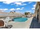 Backyard pool with blue water and lounging area, perfect for outdoor relaxation and entertainment at 6292 Belgium Dr, Las Vegas, NV 89122