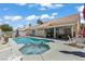 A delightful backyard with a sparkling pool and relaxing jacuzzi, great for leisure and entertainment at 6292 Belgium Dr, Las Vegas, NV 89122