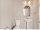 Powder room featuring a pedestal sink, toilet and neutral decor at 6402 Parrot Ridge Ct, Las Vegas, NV 89139