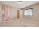 Bedroom features accent wall, window, and closet at 6402 Parrot Ridge Ct, Las Vegas, NV 89139