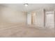 Light bedroom with a walk-in closet, light-colored carpet, and neutral walls at 6402 Parrot Ridge Ct, Las Vegas, NV 89139