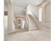 Bright entryway with staircase and large window, providing ample natural light at 6402 Parrot Ridge Ct, Las Vegas, NV 89139