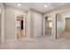 Hallway with neutral color scheme and multiple doorways leading to various rooms at 6402 Parrot Ridge Ct, Las Vegas, NV 89139