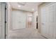 Hallway leads to various rooms, including a bedroom and bathroom, all with neutral tones at 6402 Parrot Ridge Ct, Las Vegas, NV 89139