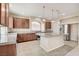 Spacious kitchen with stainless steel appliances, granite countertops, and a large island with pendant lighting at 6402 Parrot Ridge Ct, Las Vegas, NV 89139