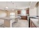 Modern kitchen with stainless steel appliances, a large island, and plenty of cabinet space at 6402 Parrot Ridge Ct, Las Vegas, NV 89139