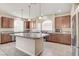 Beautiful kitchen with stainless steel appliances, a granite island, and pendant lighting at 6402 Parrot Ridge Ct, Las Vegas, NV 89139