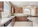 A spacious kitchen with granite countertops, stainless steel appliances, and ample cabinet space at 6402 Parrot Ridge Ct, Las Vegas, NV 89139