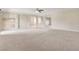 Expansive living room with neutral carpet, recessed lighting, and architectural cut-outs providing an open and airy feel at 6402 Parrot Ridge Ct, Las Vegas, NV 89139