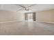 Spacious living room featuring wood-look ceramic tile flooring, recessed lighting, and a ceiling fan at 6402 Parrot Ridge Ct, Las Vegas, NV 89139