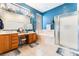 En suite bathroom featuring a double vanity, soaking tub, and separate shower at 7076 Oakleigh Dr, Las Vegas, NV 89110