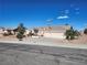 Welcoming single-story home with a three-car garage featuring desert landscaping at 7076 Oakleigh Dr, Las Vegas, NV 89110