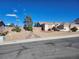 Beautiful single-story home featuring xeriscaping and a three-car garage at 7076 Oakleigh Dr, Las Vegas, NV 89110