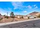 Charming single-story home featuring a well-manicured yard and a three-car garage at 7076 Oakleigh Dr, Las Vegas, NV 89110