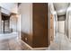 Spacious hallway with tile flooring and neutral-toned walls provide an open and airy feel at 7076 Oakleigh Dr, Las Vegas, NV 89110