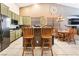 Stylish kitchen with modern appliances, a breakfast bar, and ample counter space for meal preparation at 7076 Oakleigh Dr, Las Vegas, NV 89110