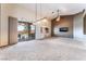 Bright living room with sliding doors, neutral paint, and carpet flooring at 7076 Oakleigh Dr, Las Vegas, NV 89110