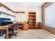 Cozy home office space with built-in shelving and a comfortable chair at 7076 Oakleigh Dr, Las Vegas, NV 89110