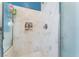 Shower with glass doors and modern white marble-look patterned walls at 7076 Oakleigh Dr, Las Vegas, NV 89110