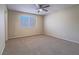 Comfortable bedroom featuring carpet flooring, neutral walls, and a ceiling fan at 713 Wheat Ridge Ln # 102, Las Vegas, NV 89145