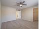 Neutral bedroom with ceiling fan and walk-in closet offers a calm and comfortable retreat at 713 Wheat Ridge Ln # 102, Las Vegas, NV 89145