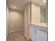 Hallway featuring neutral walls, carpeted floors, and cabinet storage for organization at 713 Wheat Ridge Ln # 102, Las Vegas, NV 89145