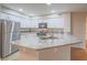 Bright kitchen showcasing granite countertops, stainless steel appliances, and white cabinetry at 713 Wheat Ridge Ln # 102, Las Vegas, NV 89145